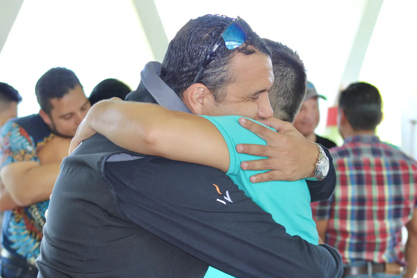 Jorge Luis Monterroza hugs a participant after a dynamic